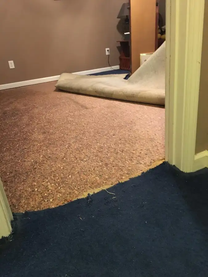 Carpet pad removal revealing water damage during Drying & Dehumidification in Village of Oak Creek (Big Park)